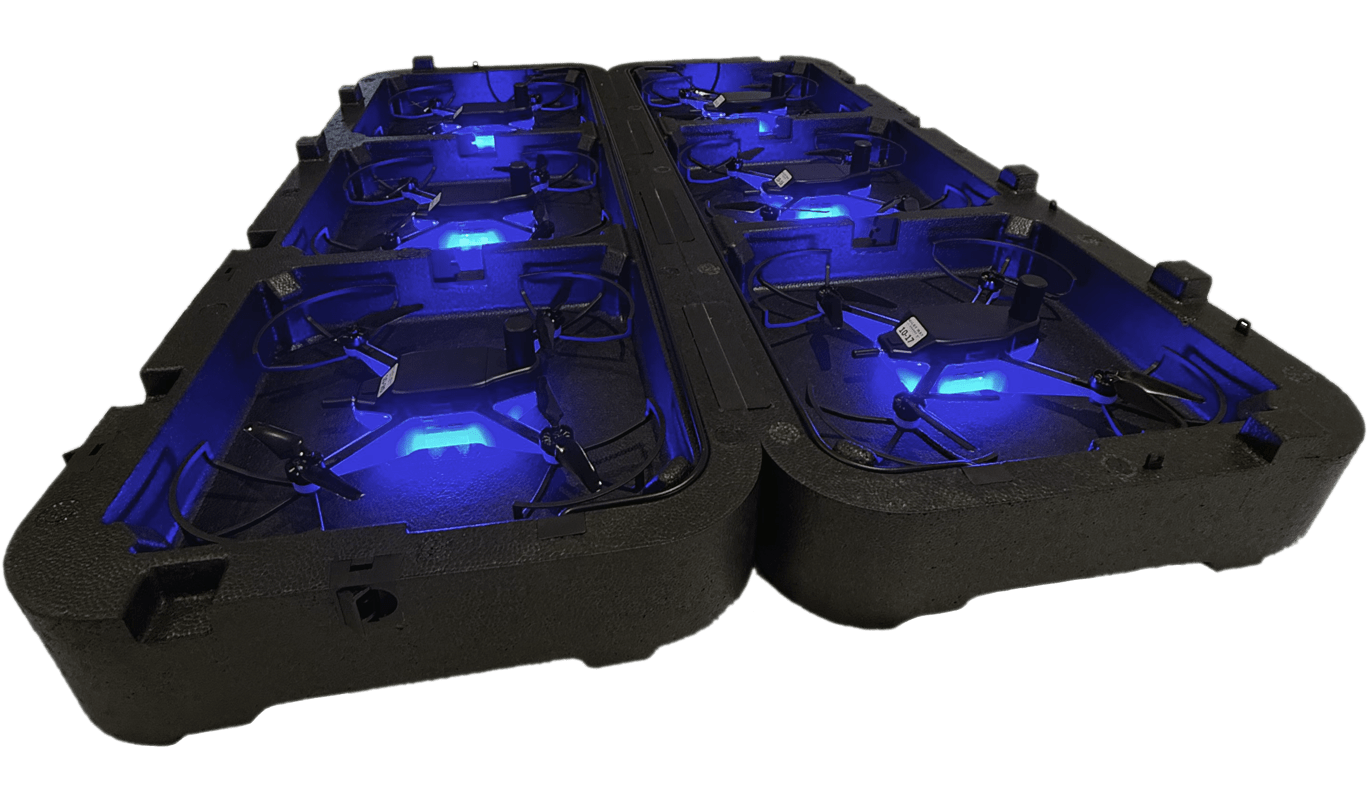 Transport case with multiple Capella drones glowing blue